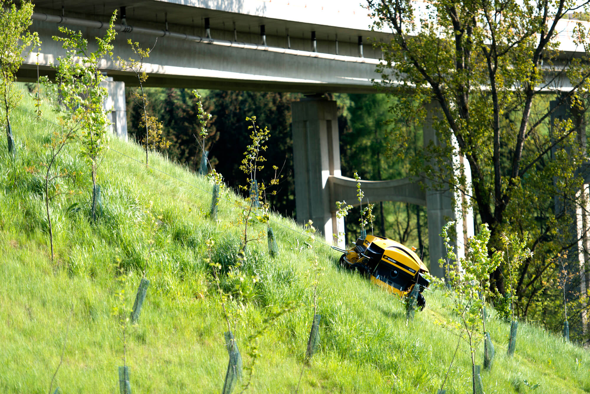 SPIDER ILD02 hillside mower working on a steep embankment