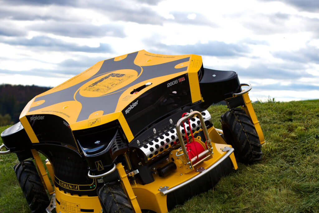 Closeup of SPIDER 2SGS EFI mower on a hill