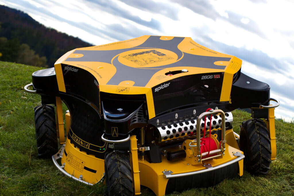 Closeup of a SPIDER 2SGS EFI mower on a hill